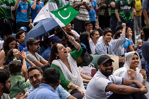 A fan with Pakistan flag at viewing party